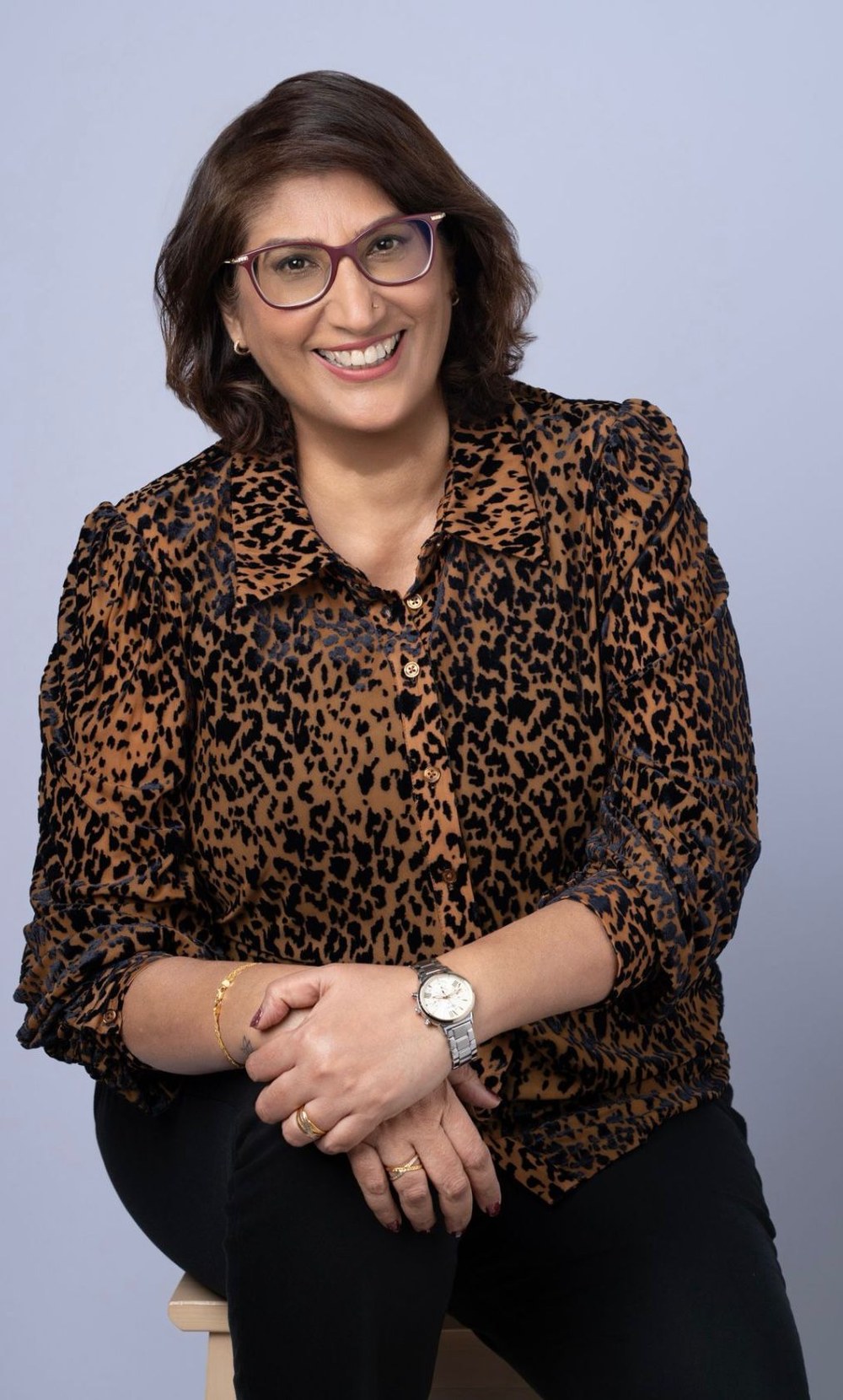 Salwin, founder of Arjava Employment Services, smiling warmly